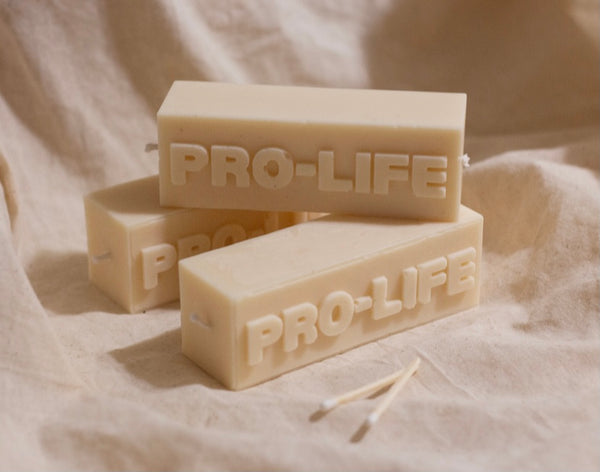 image of decorative candle design that spells out pro life  - three candles stacked on each other 
